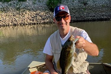 John holding a fish